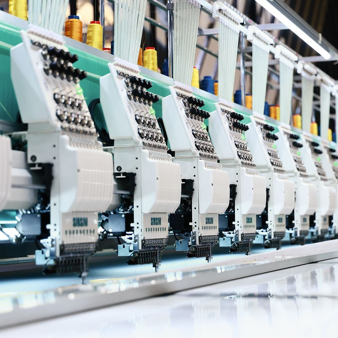 Sinsim multi-head embroidery machines on a production floor