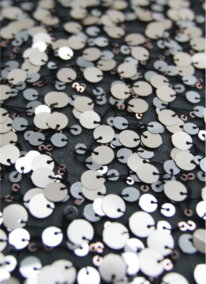 Sequin embroidery made with a Sinsim sequin device